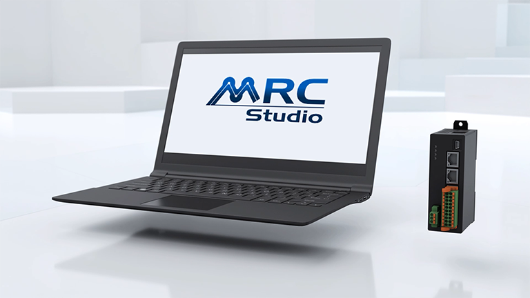MRC Studio robot programming environment - black laptop with MRC Studio software logo 